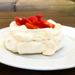 pavlova with whipped cream and strawberries